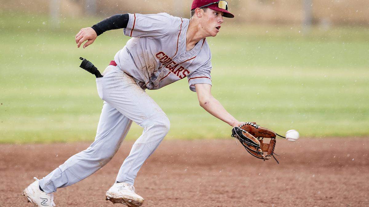 Golden Valley junior Koen Heupel (6) fields a ground ball before throwing to first to record an out during a game against Buhach Colony at Buhach Colony High School in Atwater, Calif., on Thursday, May 4, 2023.