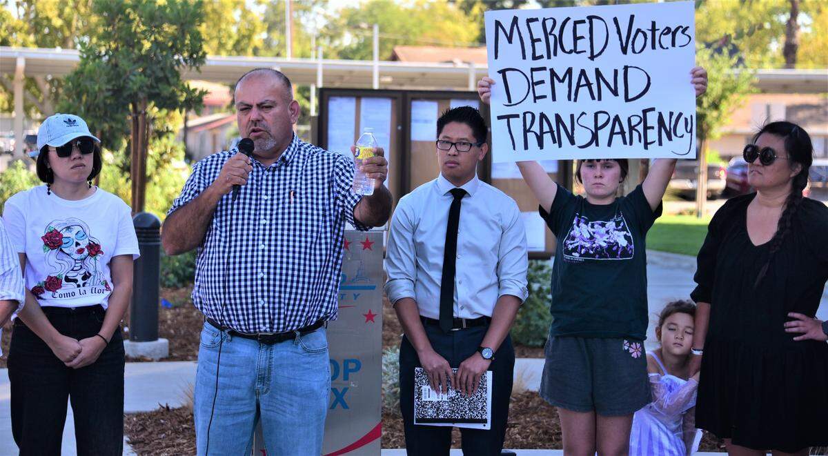Merced County Supervisor Rodrigo Espinoza talks to protesters Friday, Oct. 14, 2022, outside the Merced County Elections Office about the errors that appeared on election ballots sent out in some Merced County precincts.
