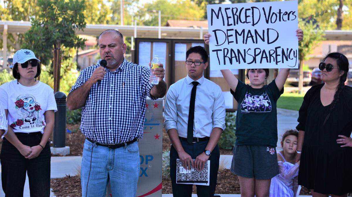 Merced County Supervisor Rodrigo Espinoza talks to protesters outside the Merced County election office about the errors that appeared on election ballots that were sent out in some Merced County precincts on Friday, Oct. 14, 2022.