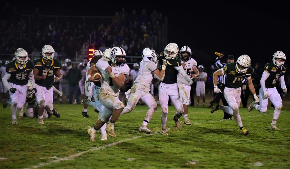 Escalon High running back Ryker Peters runs the ball against Hilmar during a playoff game on Friday, Nov. 11, 2022, at McSweeney Field in Hilmar, Calif.
