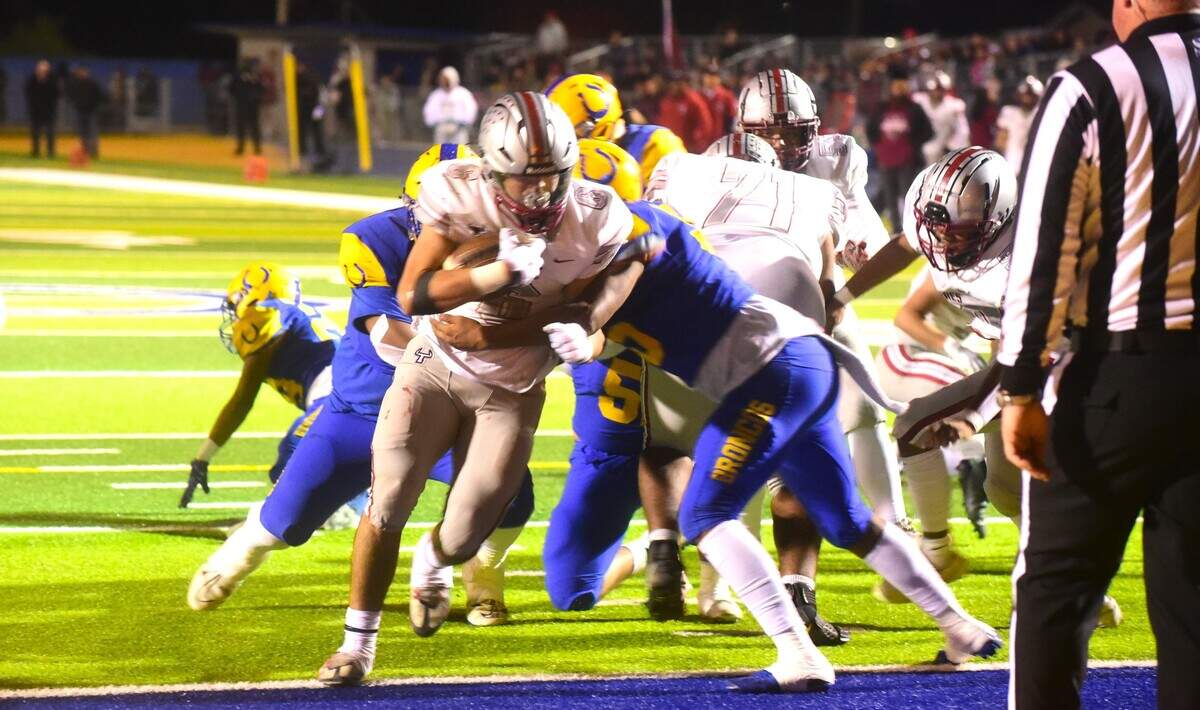 Torres High School running back Amani Sua (6) scores one of his three touchdowns during a 69-14 win over Dos Palos in the Central Section Division IV championship game on Friday, Nov. 24, 2023.