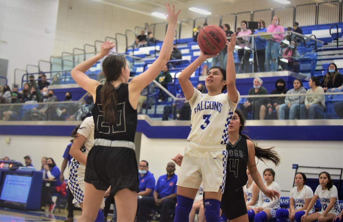 Atwater High senior Mariela Fernandez (3) goes up for a shot during a playoff game against Tracy on Thursday, Feb. 17, 2022. Fernandez scored 20 points to help the Falcons win 71-52.