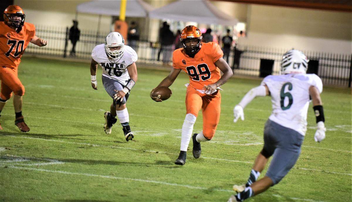 Merced High sophomore Quintell Dupree (99) runs the ball up field against Central Valley on Friday, Oct. 21, 2022 at Cathie Hostetler Stadium at Merced High School.