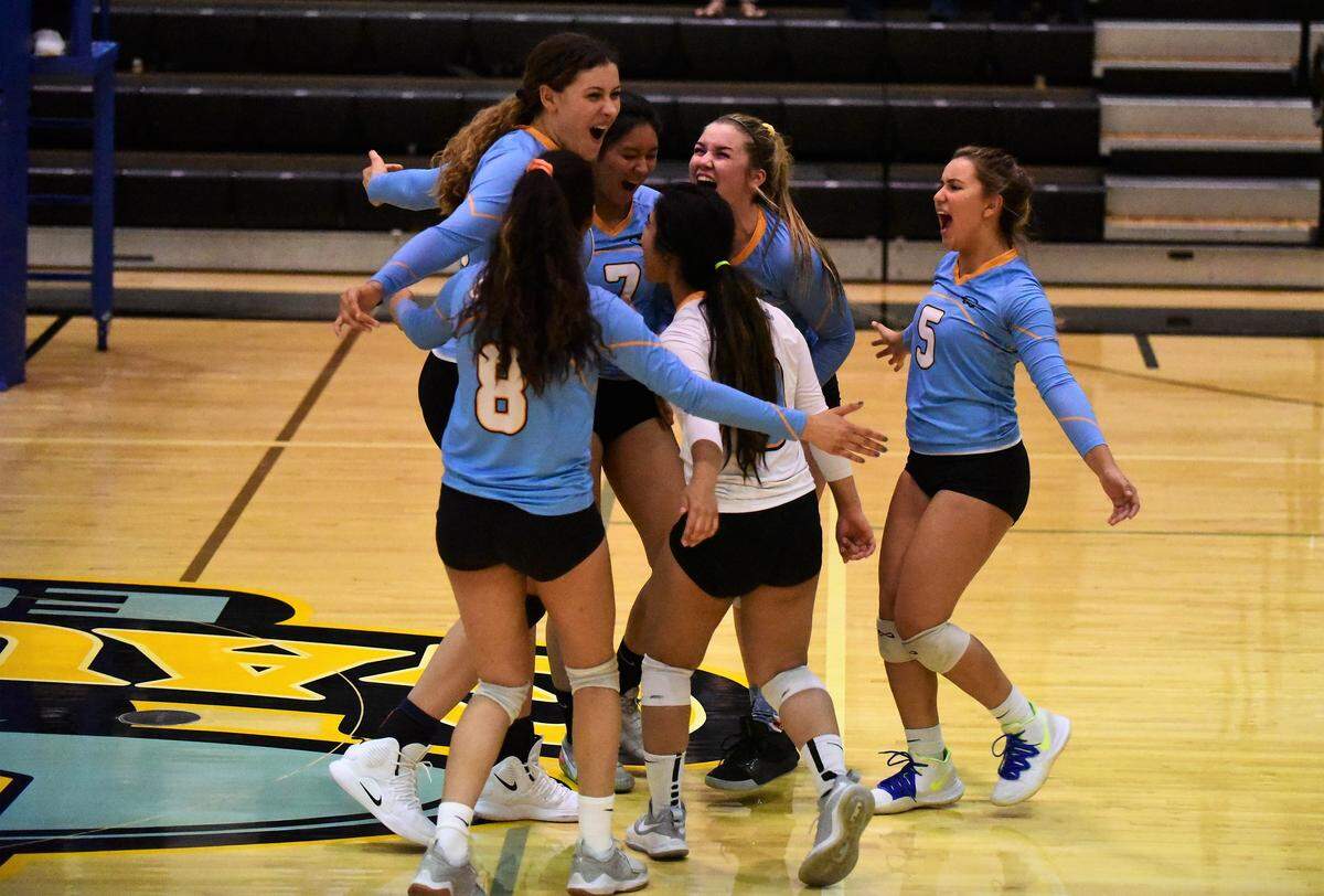 The El Capitan girls volleyball team celebrates a point during their three-game sweep of Beyer in the Sac-Joaquin Section Division III playoffs on Tuesday, Oct. 29, 2019.