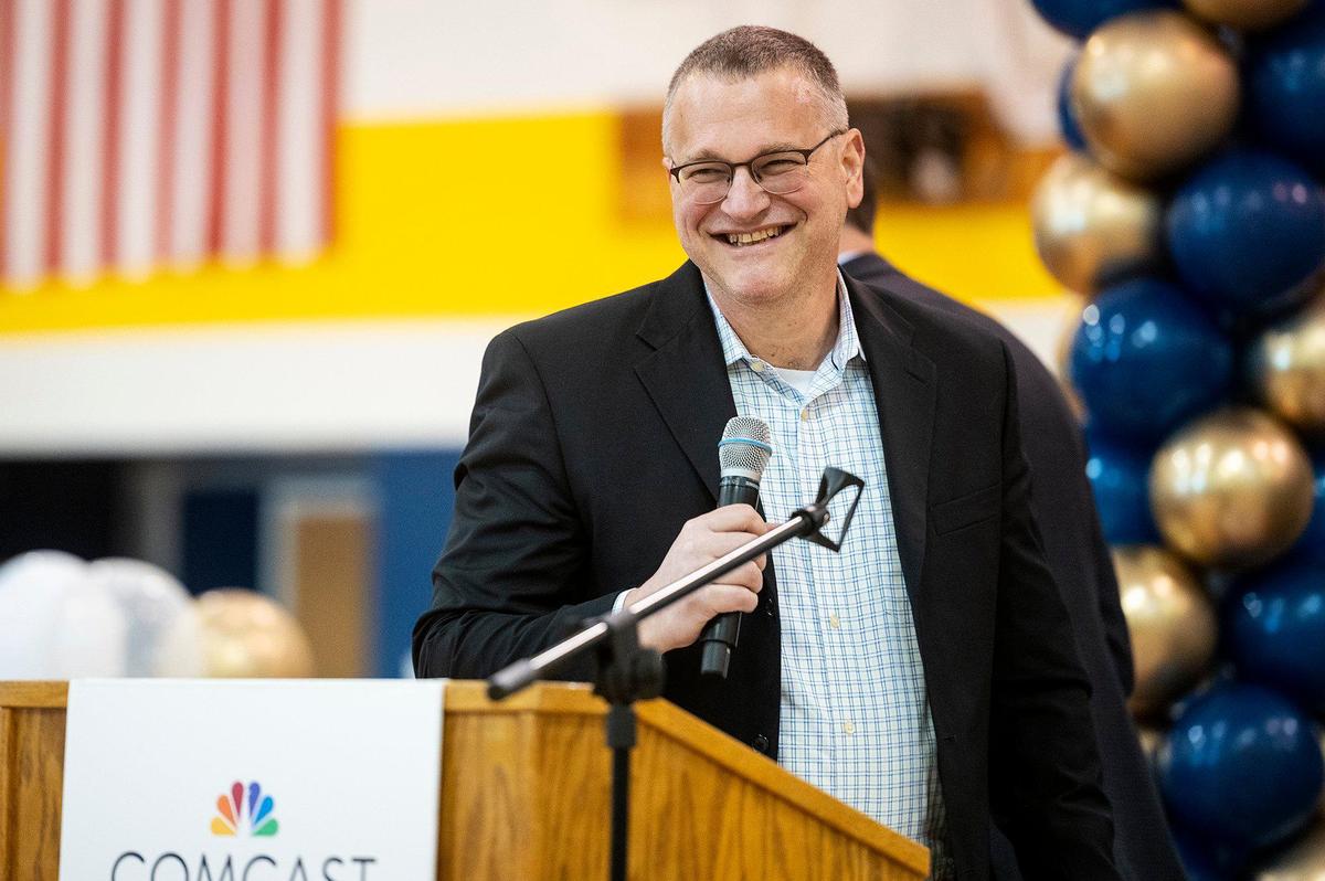 Comcast Chief Network Officer Elad Nafshi, speaks to eighth-graders during a ceremony announcing a $4.5 million investment to bring high-speed internet and broadband services to the area, at Cesar E. Chavez Middle School in Planada, Calif., on Monday, April 17, 2023. According to Nathan Ahle, Comcast Director of Government Affairs for the South Valley, the $4.5 million investment involves extending the existing network from nearby Merced into the town of Planada.