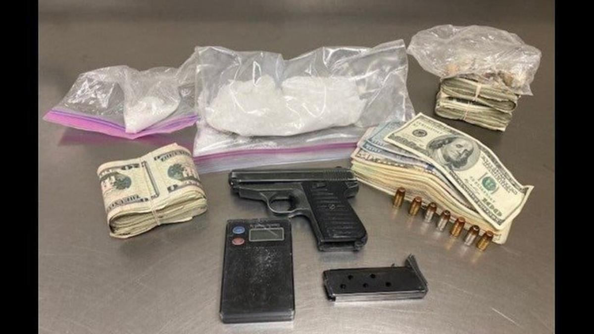 A driver arrested on a felony warrant was found with a loaded handgun and about half a pound of crystal methamphetamine, according to the Merced Police Department. Image courtesy of Merced Police Department.