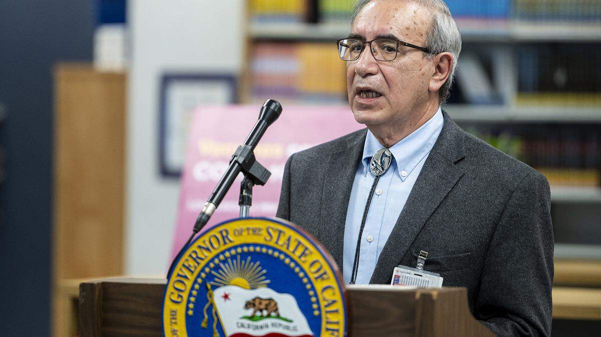 Merced County Health Officer Dr. Salvador Sandoval speaks during a news conference while visiting a vaccination clinic with Gov. Gavin Newsom at Frank Sparkes Elementary School in Winton, Calif., on Wednesday, Dec. 1, 2021.