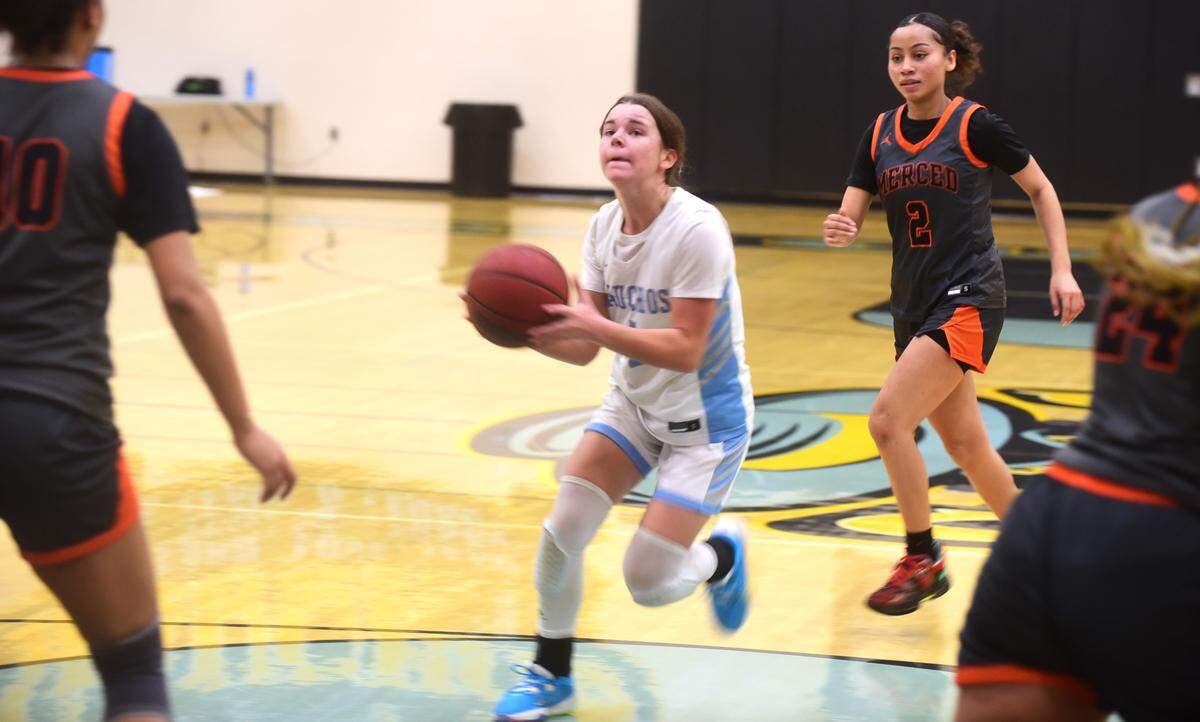 El Capitan High School sophomore guard Madysen Dietz (1) drives to the basket during a game against Merced on Thursday, Jan. 4, 2024.