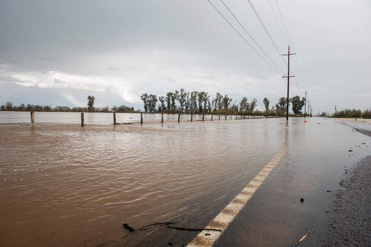A section of Highway 59 is closed between Reilly Road and McNamara Road due to flooding in Merced County, Calif., on Sunday, March 12, 2023.