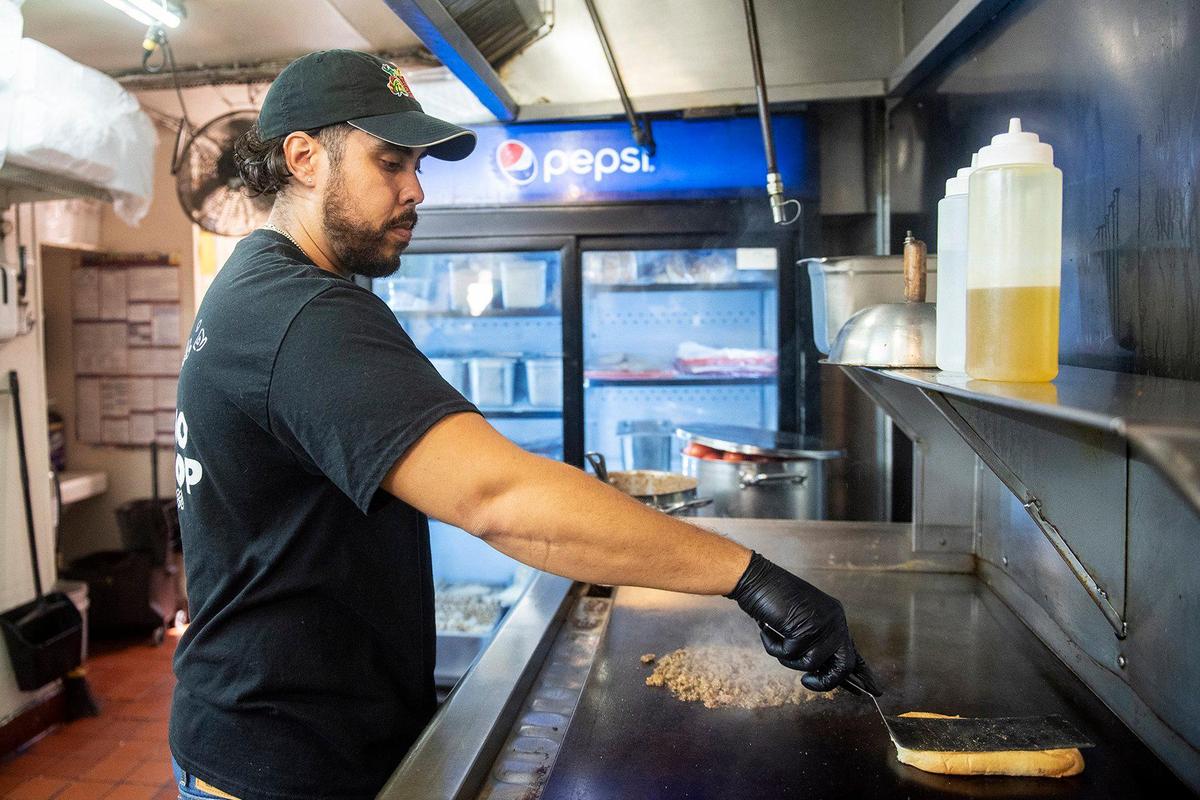 Chayanne Valencia, 33, prepares a Carne Asada Torta at Maria’s Taco Shop in Merced, Calif., on Tuesday, Oct. 15, 2024. The restaurant which is open 24 hours, has offered authentic fast Mexican food to the Merced community for 32 years.