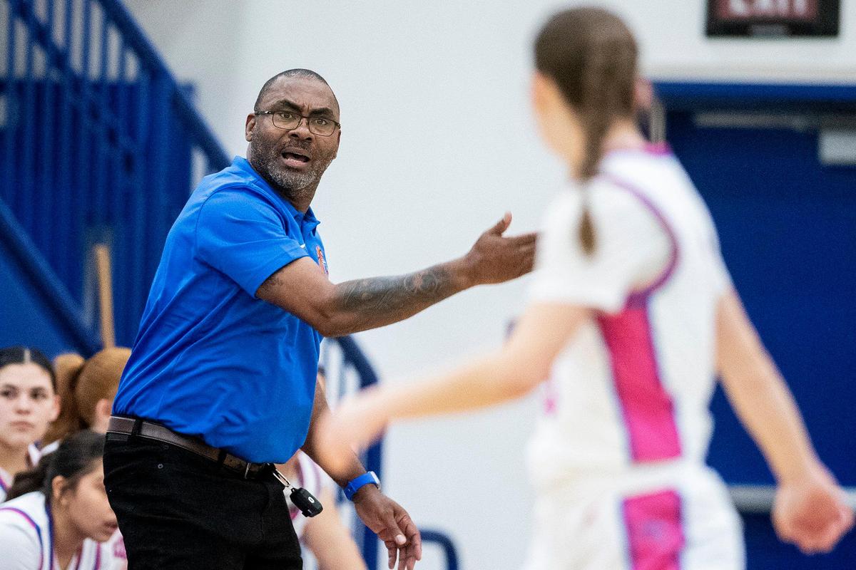 Atwater head coach Leonard Davis instructs his players during a CIF Sac-Joaquin Section Division 2 playoff game against Mountain House at Atwater High School in Atwater, Calif., on Wednesday, Feb. 14, 2024. The Falcons beat the Mustangs 95-59.