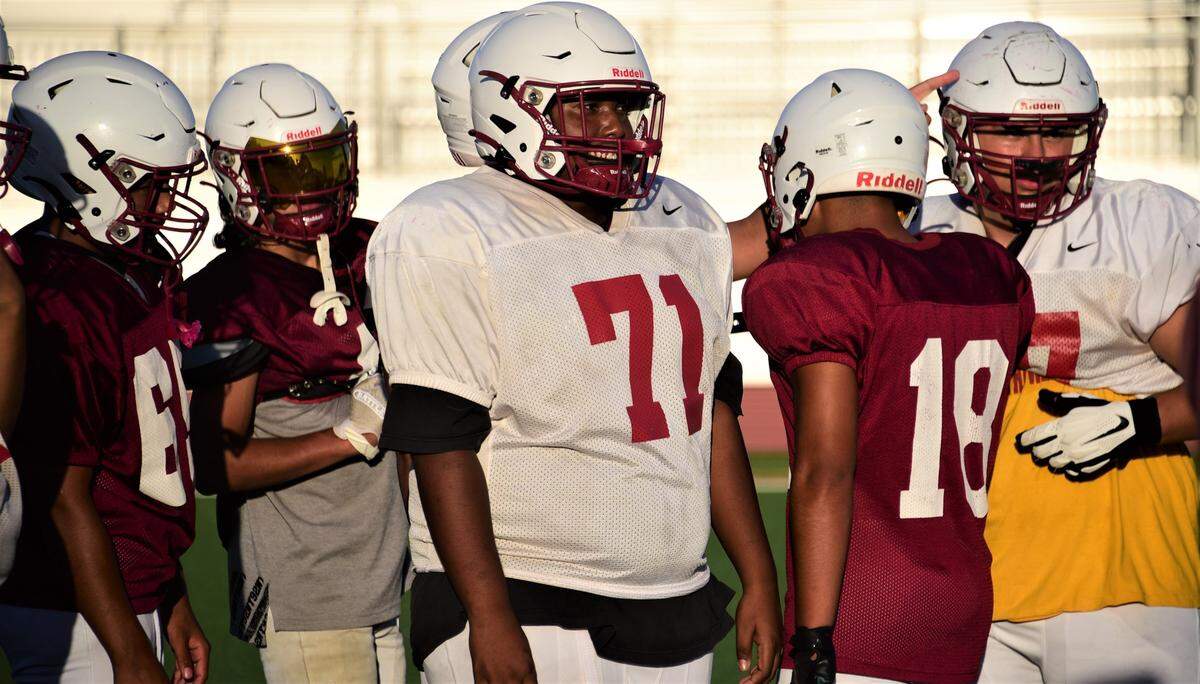 Golden Valley High School offensive lineman Karmelo Graves wears No. 71 in honor of his father Michael Graves, who was killed in a traffic collision just weeks before the start of the football season.