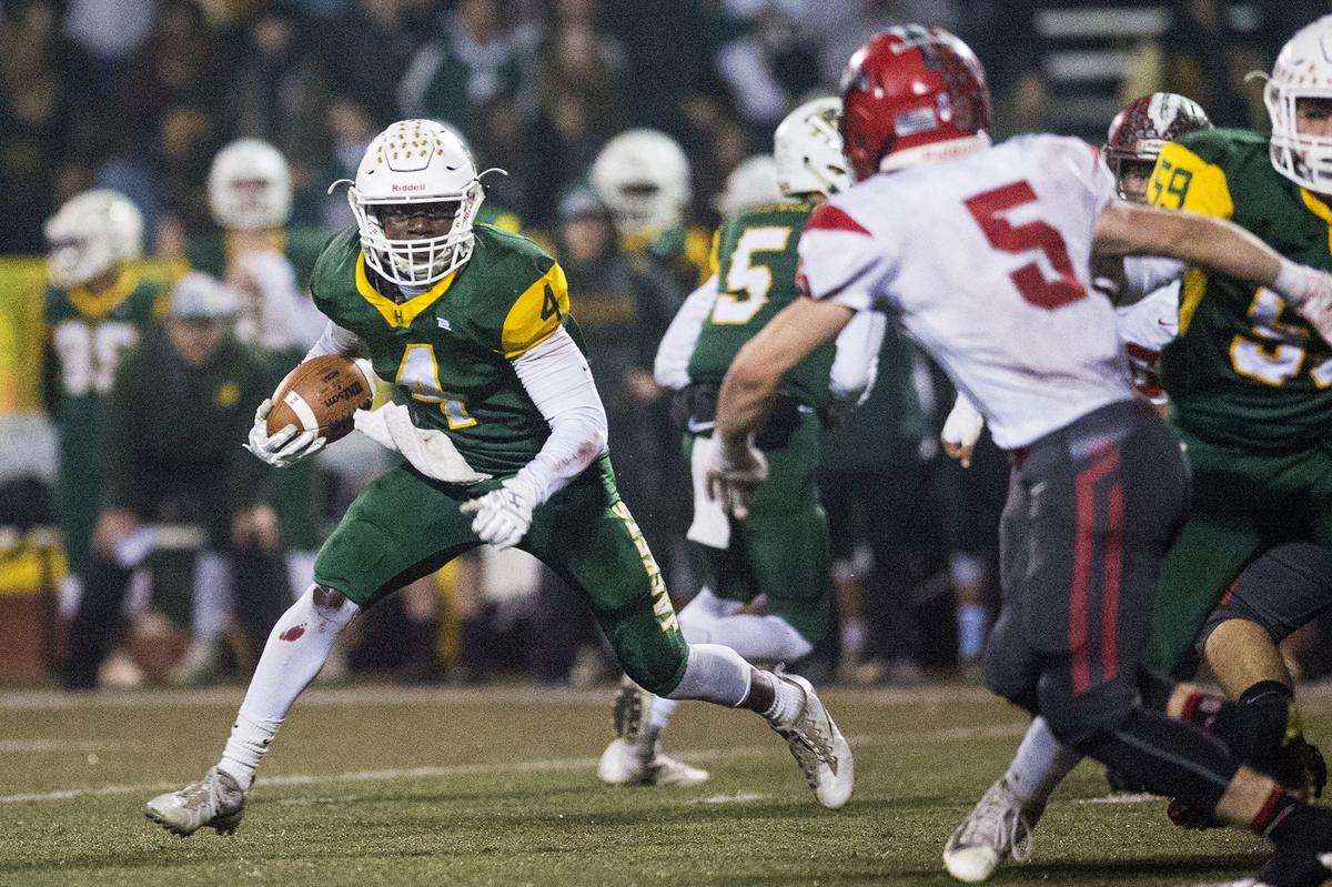 Hilmar senior Issac Sharp (4) rushes the ball during the Northern California 6-AA Championship game against East Nicolaus at Atwater High School in Atwater, Calif., on Friday, Dec. 7, 2018. The Yellowjackets beat the Spartans 48-14.