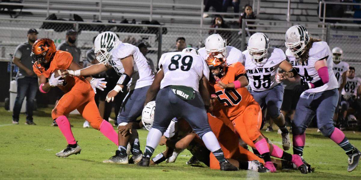 Merced High defensive lineman Malaki Leach (24) takes off after striping the ball and runs 38-yard for a touchdown during a 56-14 win over Central Valley on Friday, Oct. 21, 2022 at Cathie Hostetler Stadium at Merced High School.