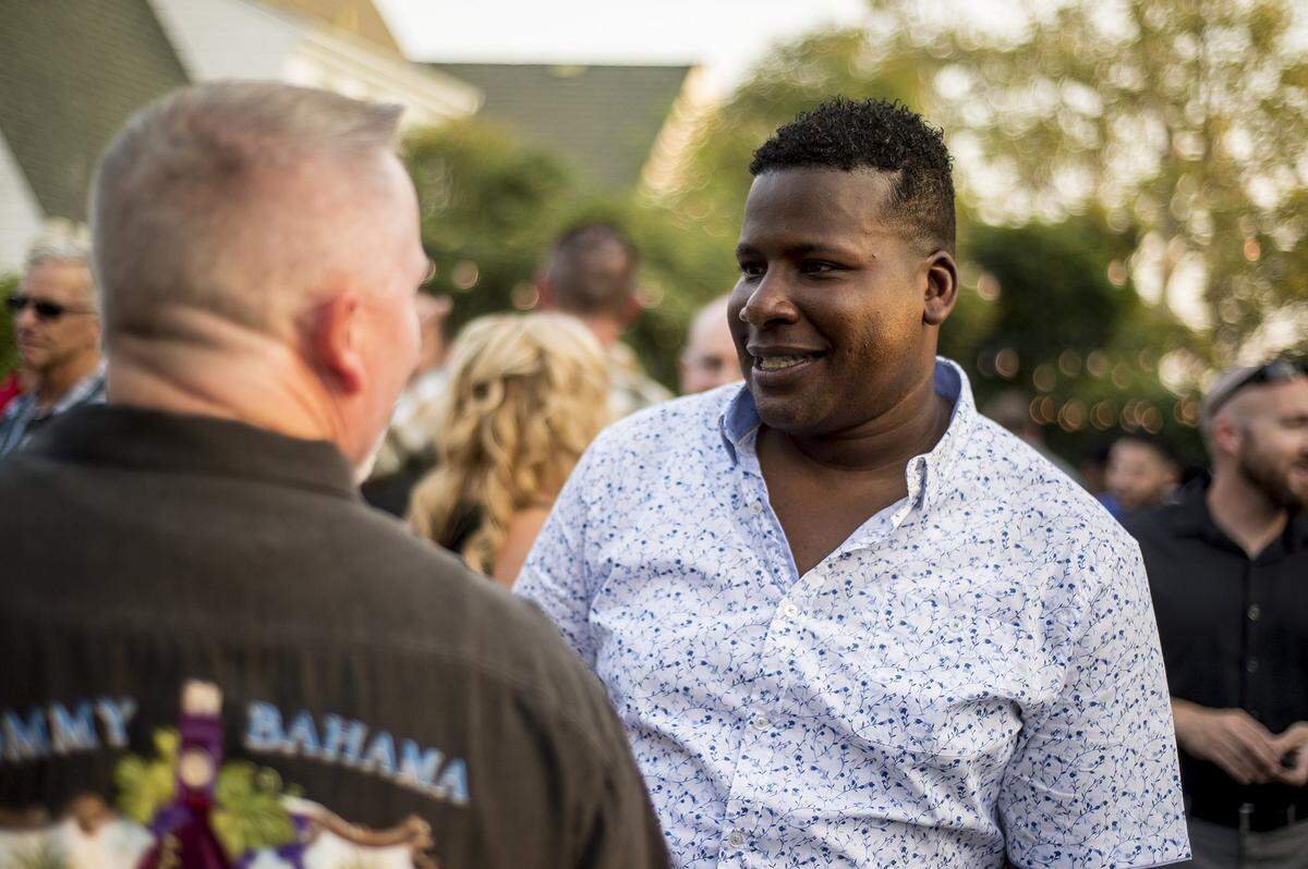Merced City Council District 6 candidate, Delray Shelton, speaks with guests during his campaign kickoff party at the Mansion House in Merced, Calif., on Thursday, Aug. 23, 2018. Shelton is a Sgt. with the Merced County Sheriff’s Office.