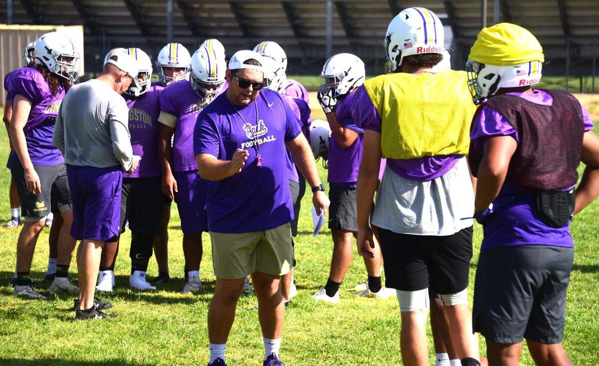 Livingston High head coach Steven Wine talks to players during practice on Thursday, Aug. 1, 2024.