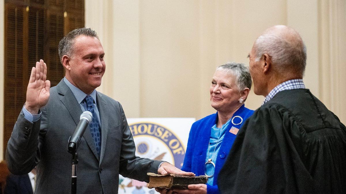 United States Representative Adam Gray, left, takes the ceremonial oath of office administered by Merced County Superior Court Judge John Kirihara, right, while Gray is joined by his mother Candice Adam-Medefind, center, during a ceremony at the Merced County Courthouse Museum in Merced, Calif., on Thursday, Jan. 30, 2025. Gray was officially sworn in as a member of the 119th congress on Jan. 3, 2025.