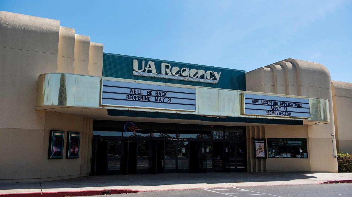 A message on the marquee outside the Regal UA Regency located at 635 Fairfield Drive, announces a May 21 reopening date in Merced Calif., on Monday, April, 12, 2021.