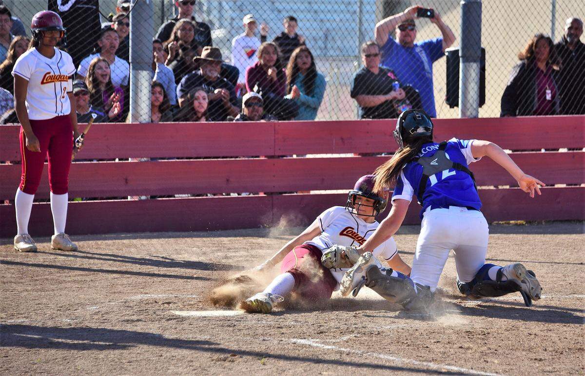 Atwater High catcher Kendall Flatt tags out Golden Valley’s Michaela Key at the plate during the Falcons’ 6-1 win over the Cougars on Wednesday, April 10, 2019 at Golden Valley High in Merced, Calif.