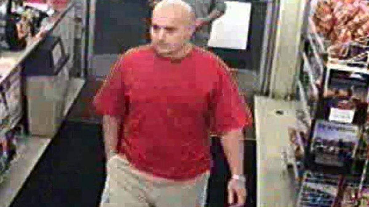 Merced detectives are trying to identify the man in the red T-shirt, who they say may be connected to a shooting at the intersection of Meadows Avenue and West Olive Avenue in Merced on Oct. 3, 2003.