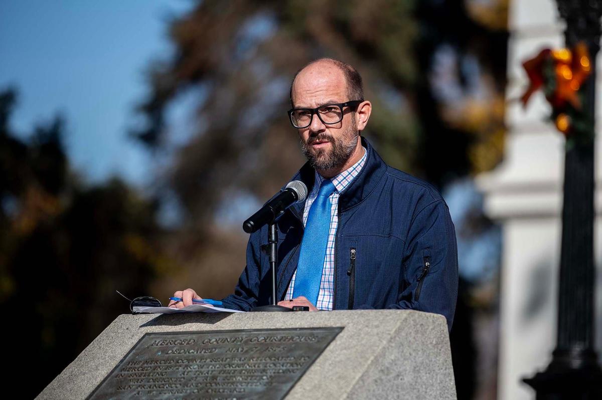 Merced County District 2 Supervisor Josh Pedrozo speaks the crowd during a ceremony to celebrate the start of a project to restore the exterior of the historic Merced County Courthouse Museum in Merced, Calif., on Wednesday, Dec. 11, 2024. More than $3 million in funding was secured for the restoration process which will help to maintain the building’s structural integrity and long-term sustainability. County officials said a time capsule containing various items will be buried on the property upon completion of the restoration project.