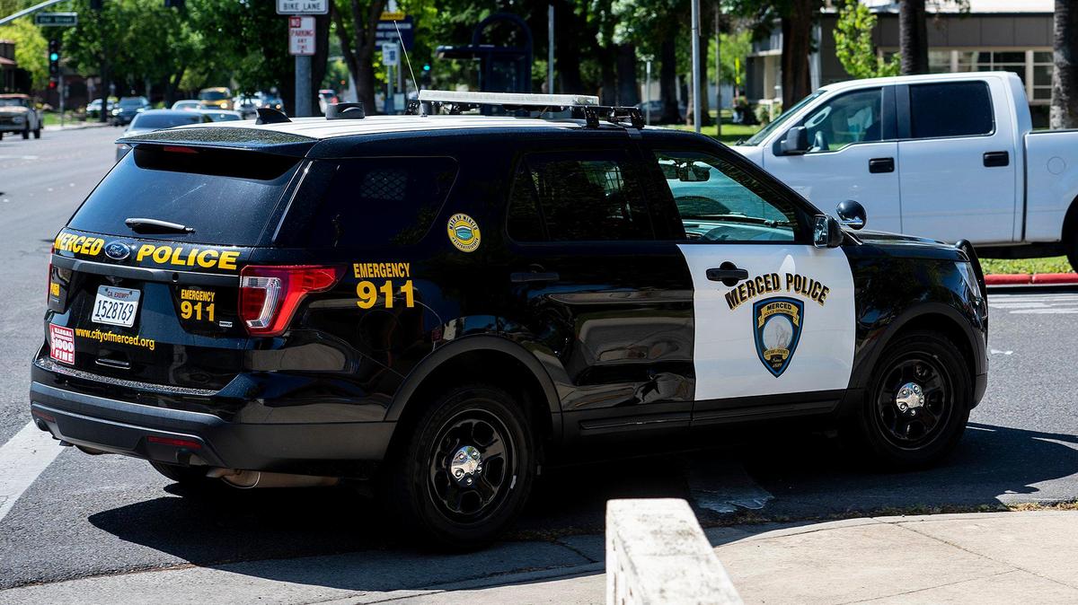 A Merced Police Department patrol vehicle turns onto West 22nd Street in Merced, Calif., on Tuesday, April 12, 2022.