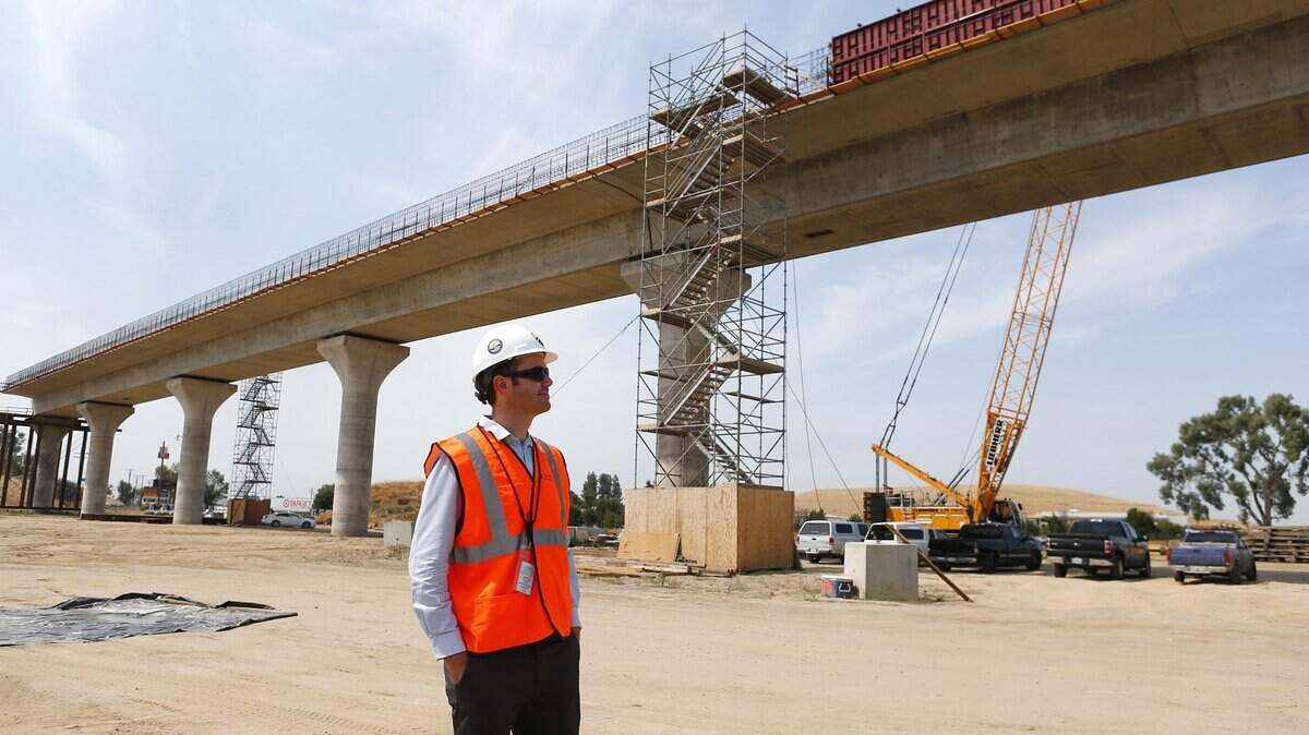 Robert Campbell, transportation engineer, California High-Speed Rail Authority, stands near the Cedar Viaduct under construction near Hwy 99 in Fresno, Calif., on Monday, July 10, 2017.