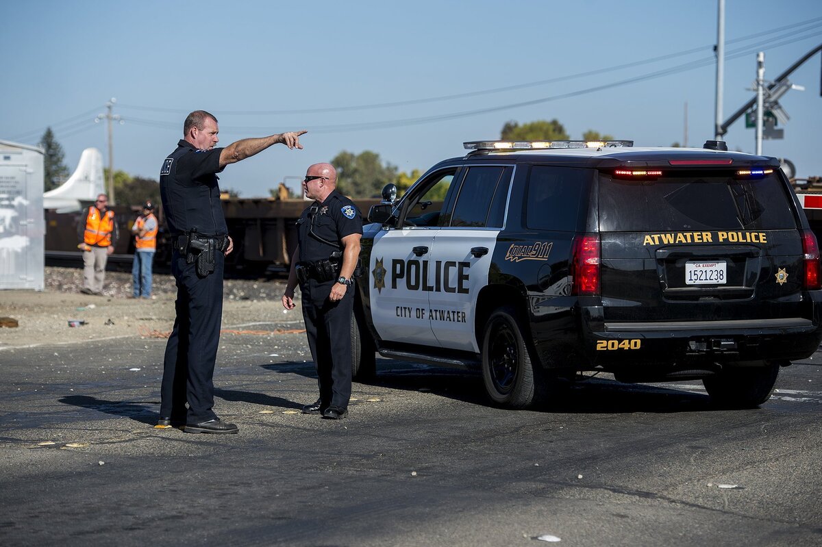 Atwater Police respond to the scene of a crash involving a freight train and an SUV near the intersection of North Buhach Road and Santa Fe Drive in Atwater, on Wednesday, Oct 17, 2018.