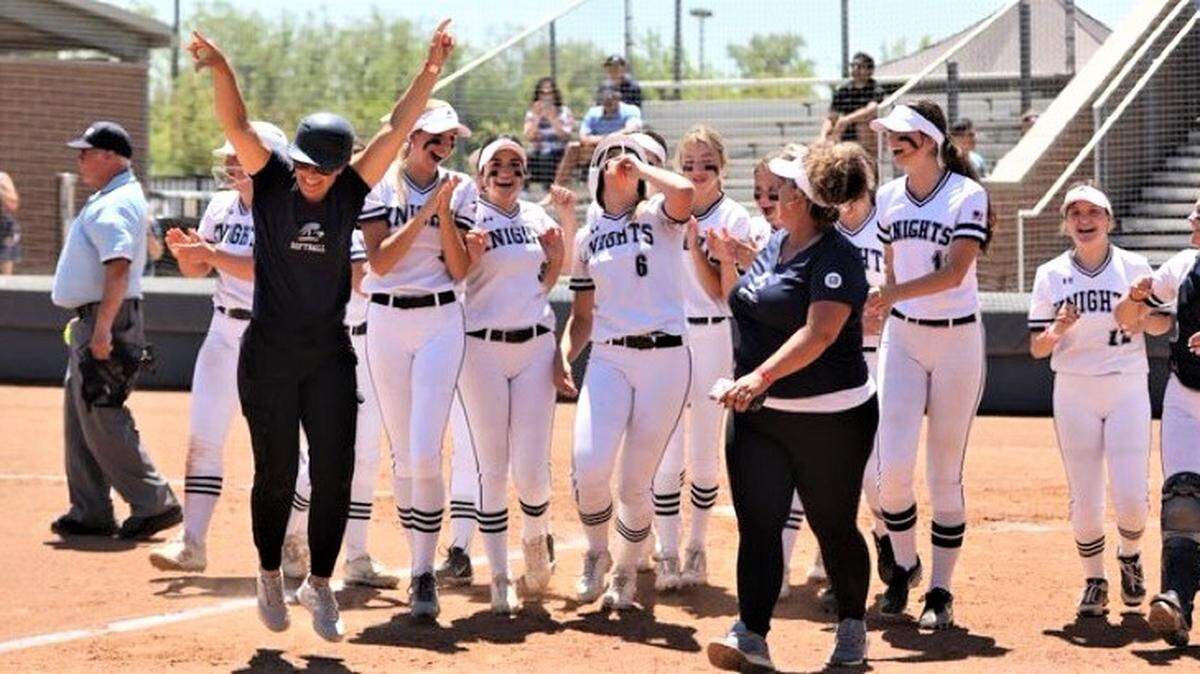 The Stone Ridge Christian High School softball teams celebrates after Breann Louters (6) two-run home run during a 10-0 win over Big Valley Christian at Cosumnes River College in Sacramento on Saturday, May 20, 2023. The Knights won the Sac-Joaquin Section Division VII championship.