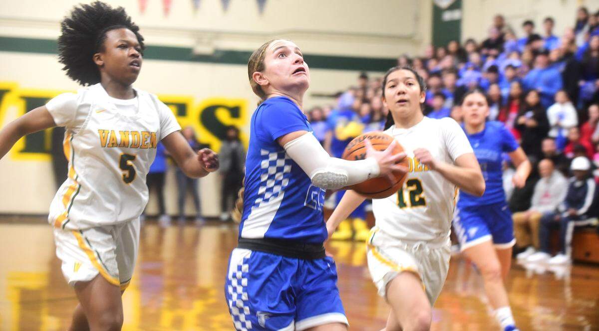 Atwater High School sophomore Madi Hiler (22) drives to the basket during a playoff game against Vanden on Monday, February 19, 2024.