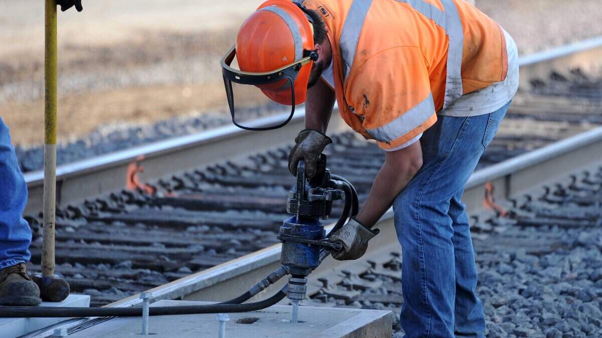 A crew works on the BNSF tracks on, Monday, Dec. 10, 2012.