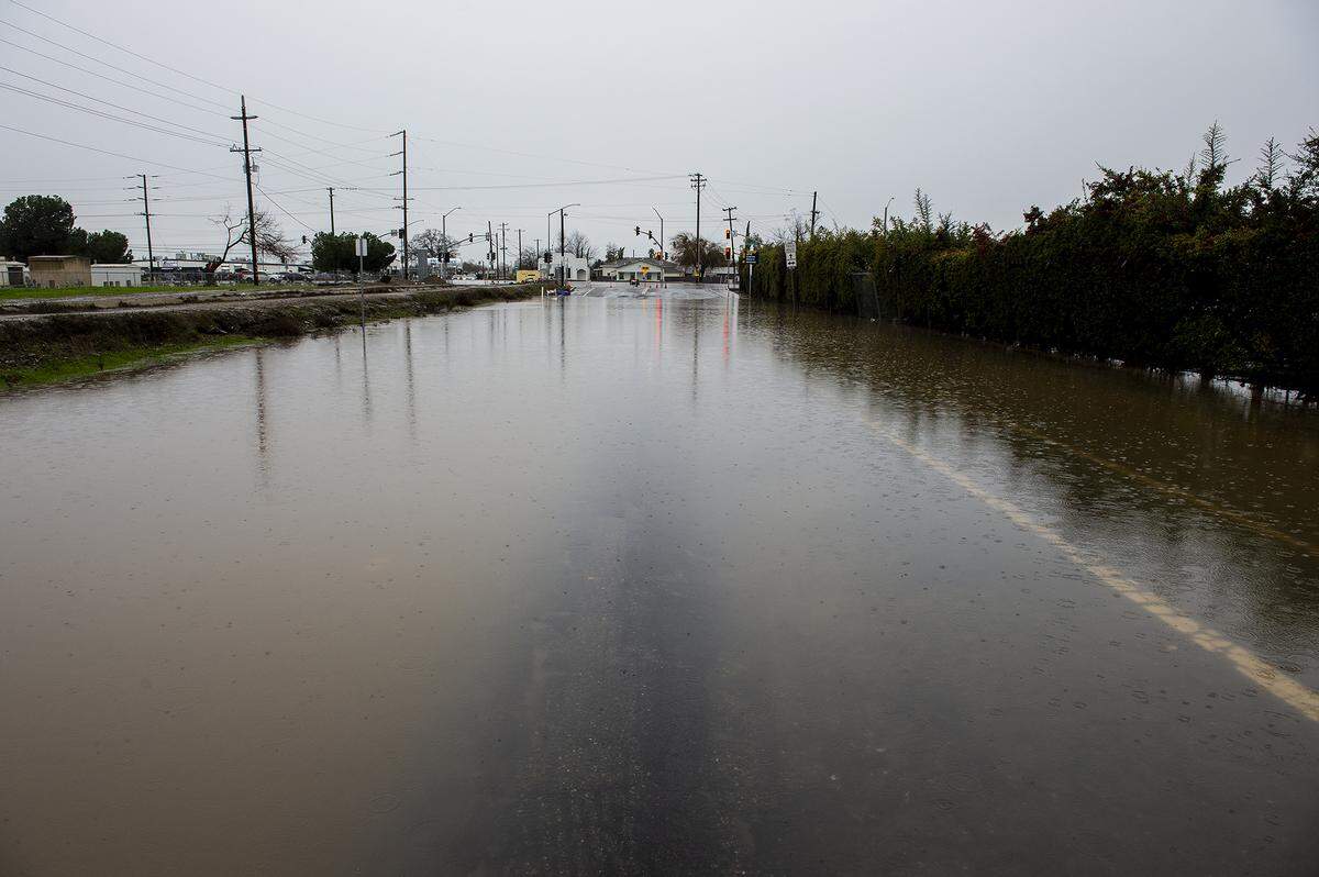 A section of Childs Avenue between G Street and Highway 59 is closed due to flooding in Merced, Calif., on Monday, Jan. 9, 2023.