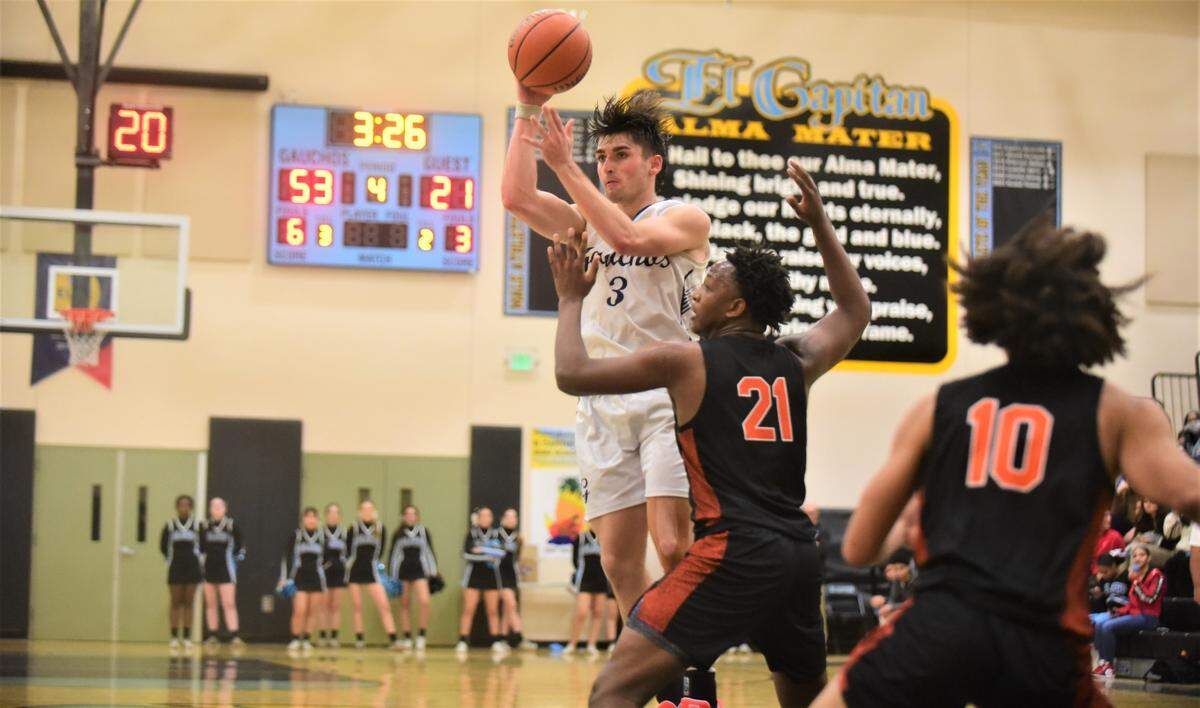 El Capitan High senior Brody Collins (3) looks to pass against Merced during a game on Wednesday, Jan. 4, 2022 at El Capitan High School.