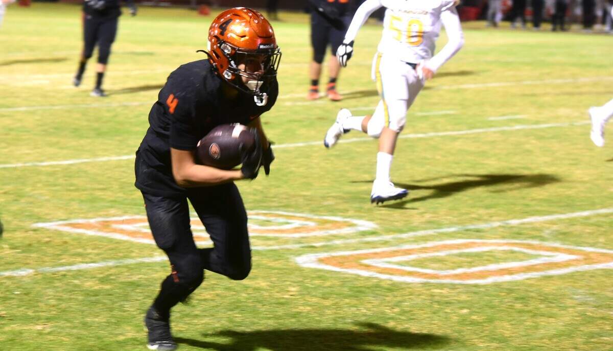 Merced High senior receiver Julian Higareda (4) runs the ball up field after making a catch during a playoff game against Rio Americano on Friday, Nov. 8, 2024 at Cathie Hostetler Stadium in Merced, Calif.