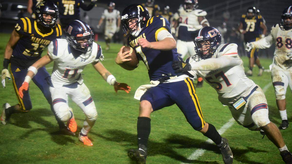 Merced College quarterback Ryan Kraft (7) runs the ball against College of the Sequoias during the Valley Center Bowl game at Merced College on Thursday, Dec. 2, 2021.