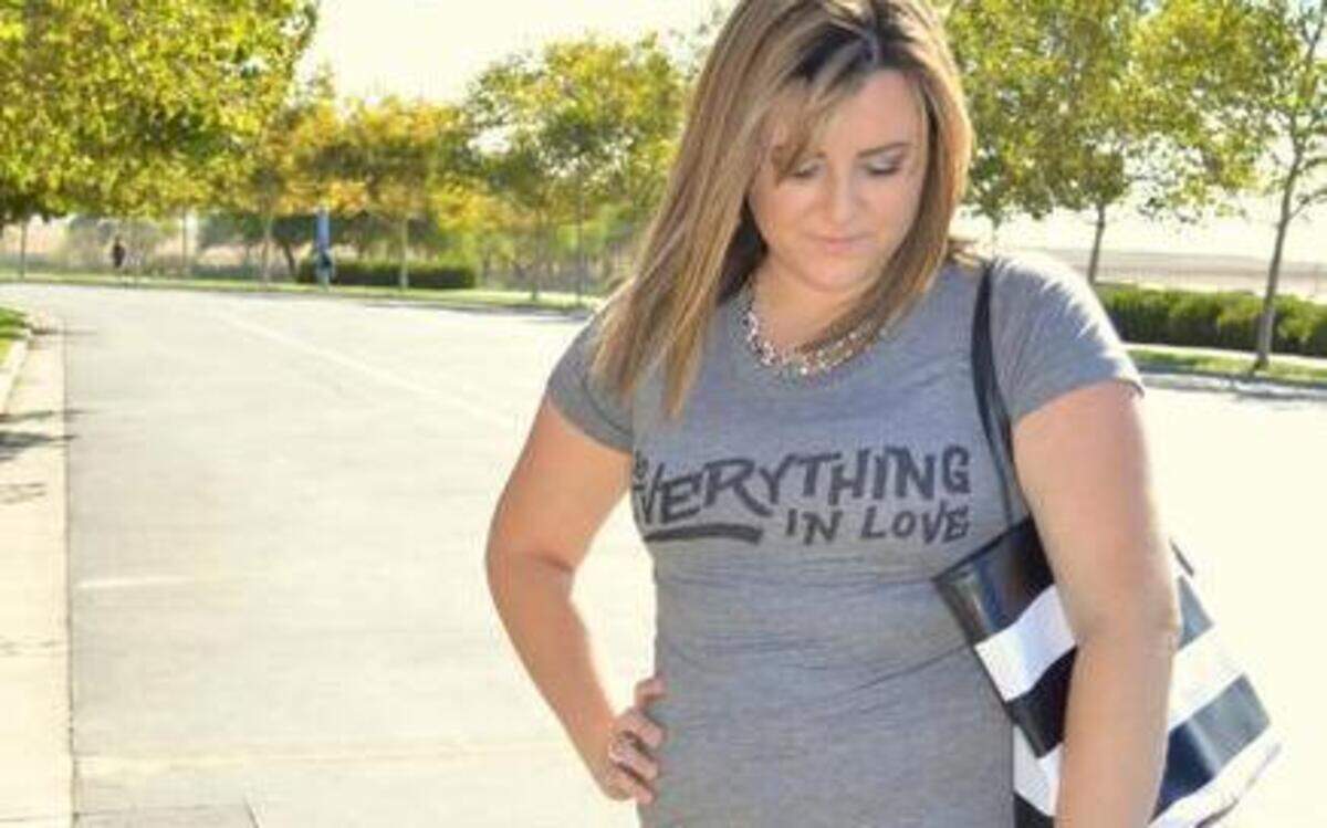 Columnist Michelle Oliver demonstrates how a screen T-shirt can be paired with jeans for a casual look. To give the outfit more flair, consider wearing heels or a sparkly necklace. In cooler weather, the outfit could be paired with a moto jacket.
