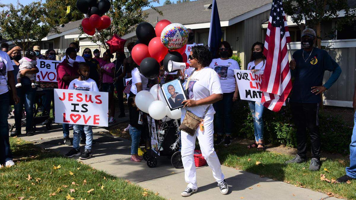 Marylene Riley talks to the group about her son Michael, who was killed in 2008, during the 12th Annual Riley Brothers Victims Remembrance Walk on Saturday, Oct. 10, 2020 in Merced, Calif.