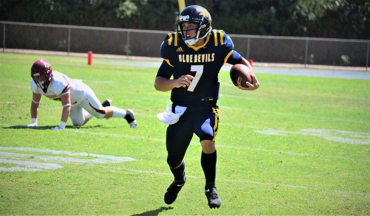 Merced College quarterback Ryan Kraft runs up field during a game against Los Medanos on Saturday, Sept. 11, 2021 at Don Odishoo Field in Merced, Calif.