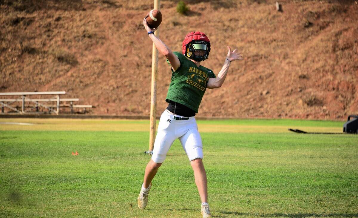 Mariposa senior quarterback Wyatt Green throws a pass during practice on Wednesday, Aug. 11, 2021.
