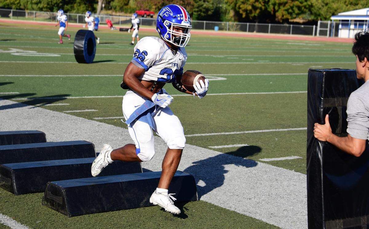 Atwater High senior running back Charles Jackson runs through drills during a Falcons practice on Wednesday, Oct. 23, 2019 at Atwater High.