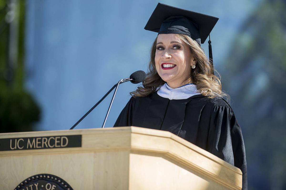 Guest speaker and CNN contributor Maria Cardona speaks to graduates during the University of California, Merced School of Social Sciences, Humanities and Arts spring commencement in the Carol Tomlinson-Keasey Quad on the UC Merced campus in Merced, Calif., on Saturday, May 12, 2018.