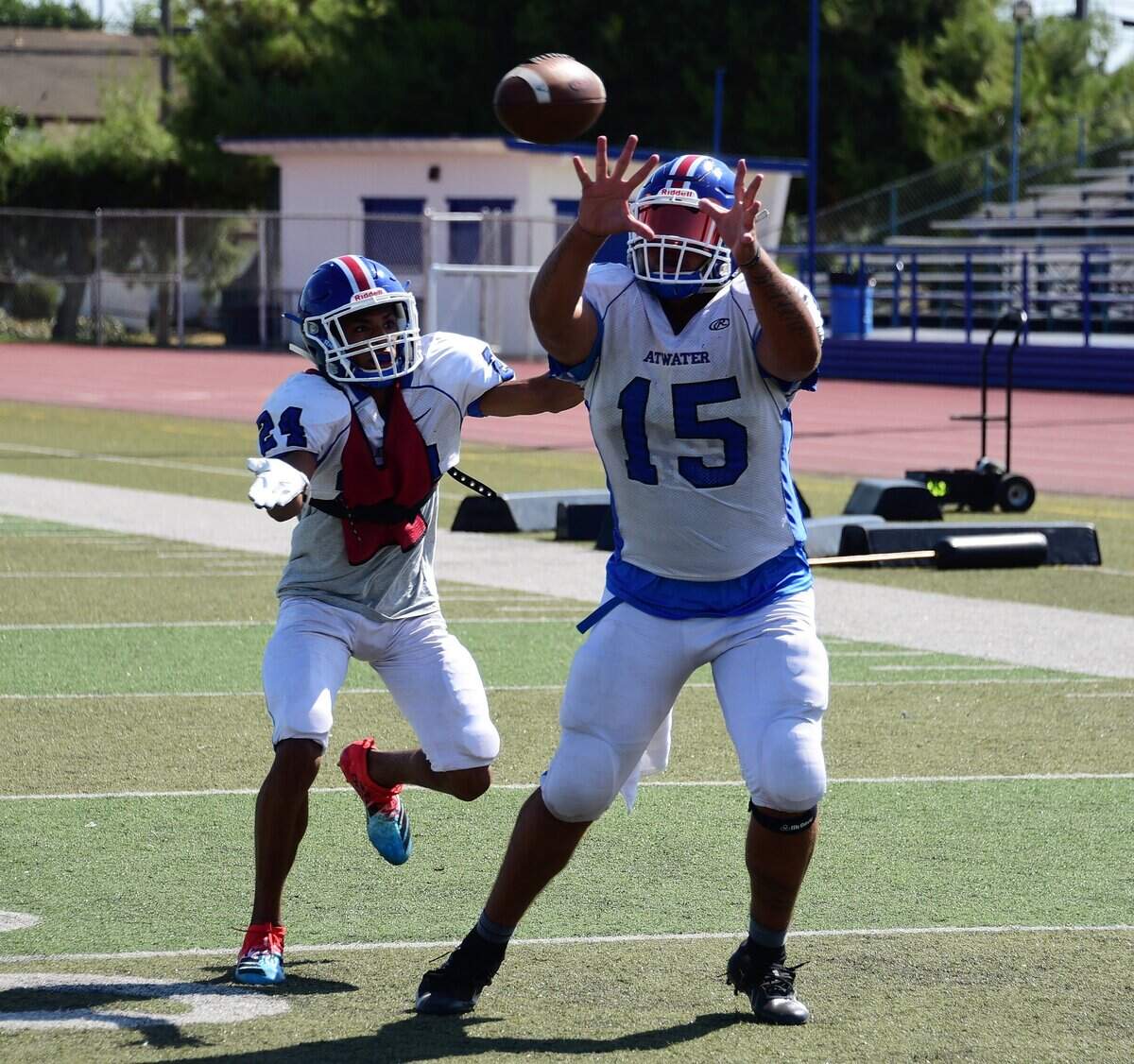 Senior tight end Xaiver Williams hauls in a pass during an Atwater High football practice on Wednesday, Aug. 21, 2019.