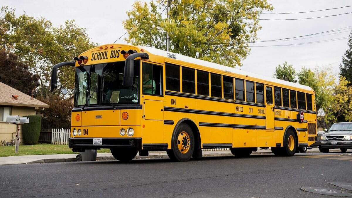 A Merced City School District bus drives along East Alexander Avenue after picking up students from Luther Burbank Elementary School in Merced, Calif., on Wednesday, Nov. 15, 2017. It may be awhile before Merced County residents see school buses on the road, as Gov. Newsom on Friday, July 17, 2020 halted in-person classes in Merced and 30 other counties, due to coronavirus.