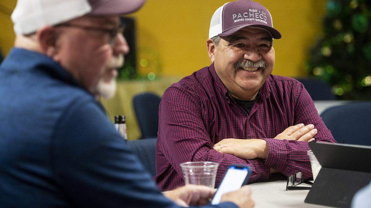 Merced County District 1 Supervisor candidate Jim Pacheco, right, speaks with supports while waiting for Primary Election voting results in Merced, Calif., on Tuesday, March 5, 2024.
