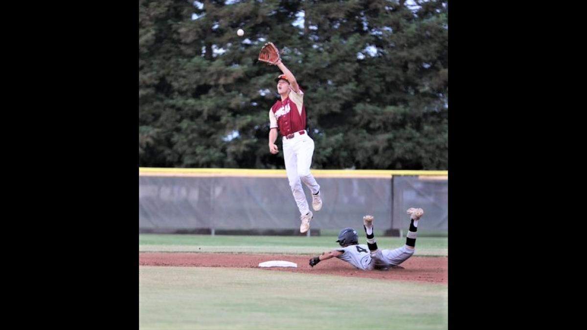 South shortstop Koen Huepel (Golden Valley) leaps for a throw as the South’s Kadyn Fillebrown (Buhach Colony) slides in safely at second base.