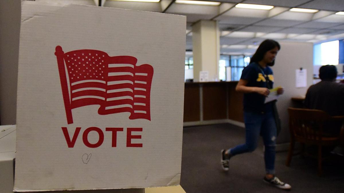 A women holds a ballot inside the Merced County Registrar of Voters office in the Administration Building on Friday, Nov. 2, 2018, days before Election Day.