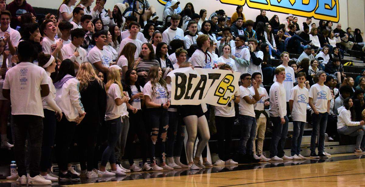The El Capitan High student section cheers on the Gauchos during a game against Buhach Colony on Wednesday, Jan. 8, 2020.