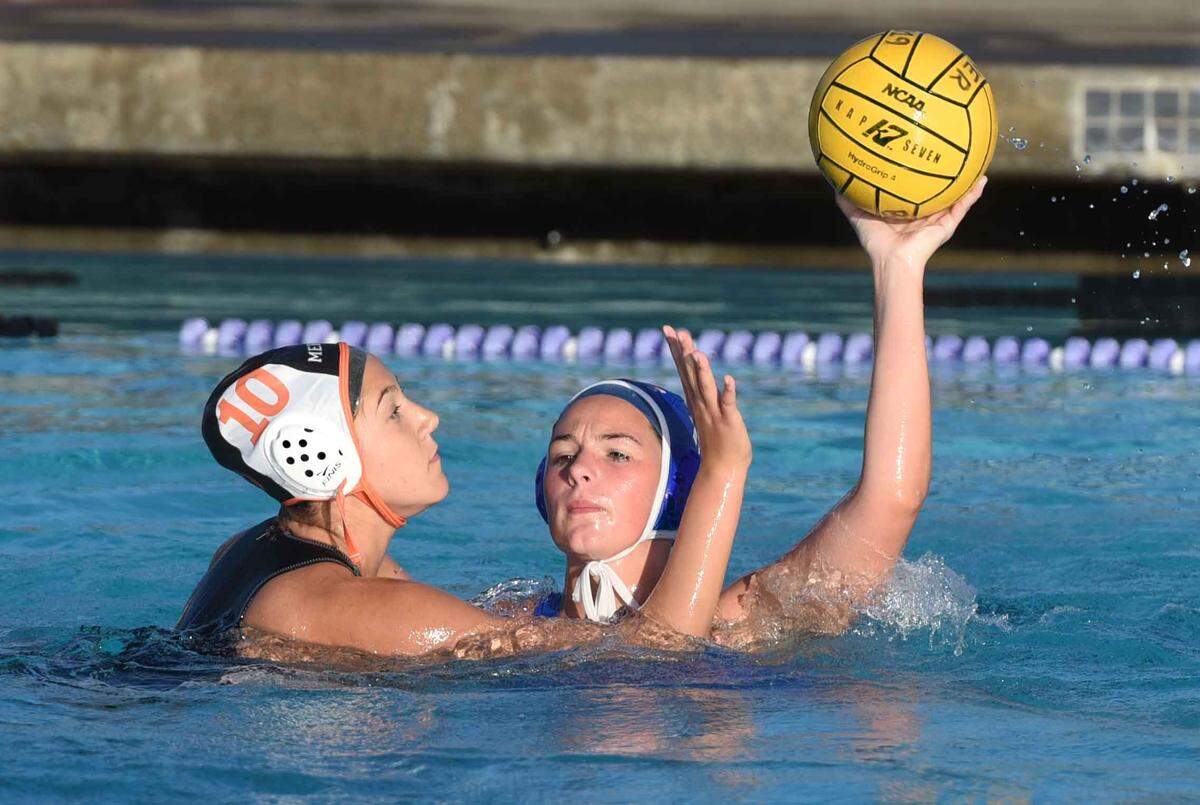 Beyer high school’s #13 Claire Krippner looks to pass the ball as she is guarded by #10 Hannah Steele-Quevedo of Merced high school on Tuesday afternoon November 5, 2019 in a match at Johansen high school in Modesto, Calif.