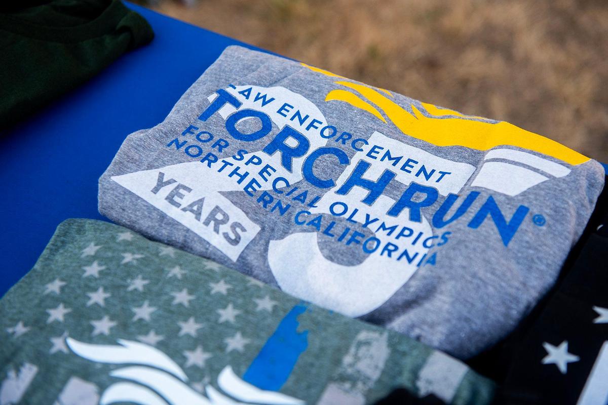 Shirts sit on a table during the annual Law Enforcement Torch Run for Special Olympics Northern California in Merced, Calif., on Wednesday, June 25, 2025.