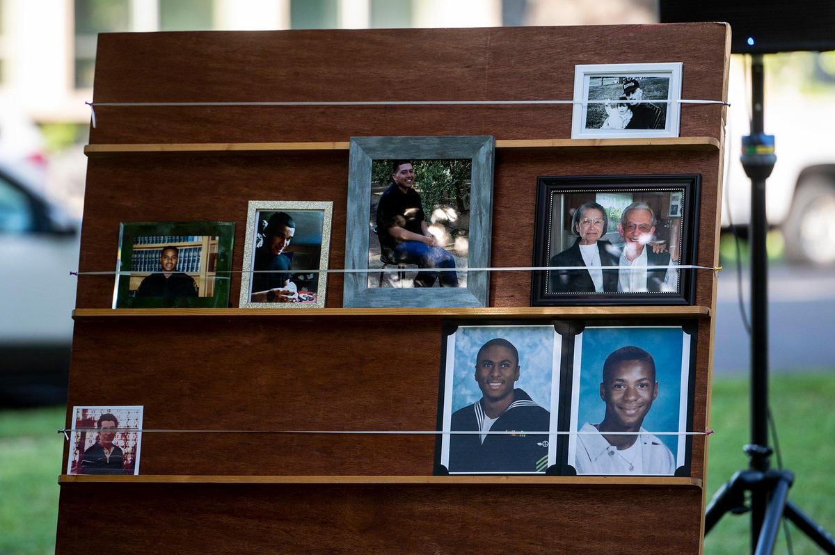 Images of victims are displayed during the annual Victims’ Rights Ceremony at Courthouse Park in Merced, Calif., on Tuesday, April 26, 2022.